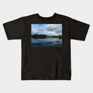 Lagoon reflections in a cloudy day Kids T-Shirt